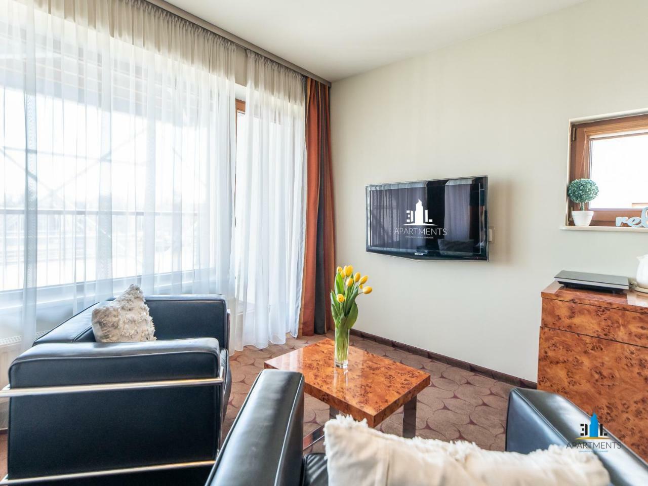 Royal Tulip Sand Колобжег Экстерьер фото A living room in a serviced apartment in Munich, Germany
